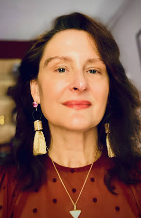 Gretl Claggett as Director