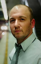 Simon Barrett as Director