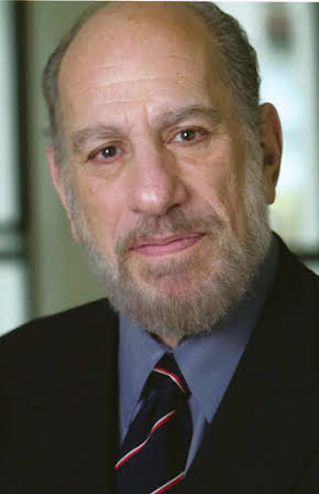 Bern Cohen as Rabbi