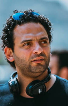 Mahmoud Karim as Director