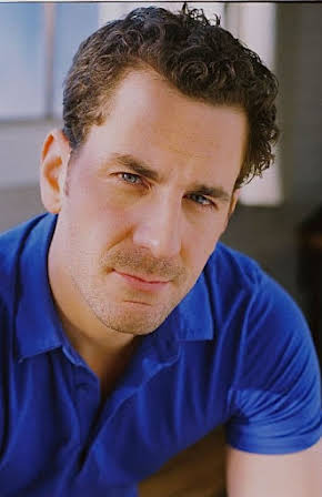 Aaron Abrams as 