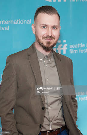 Aaron Bear as Director