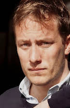 Anders August som Director